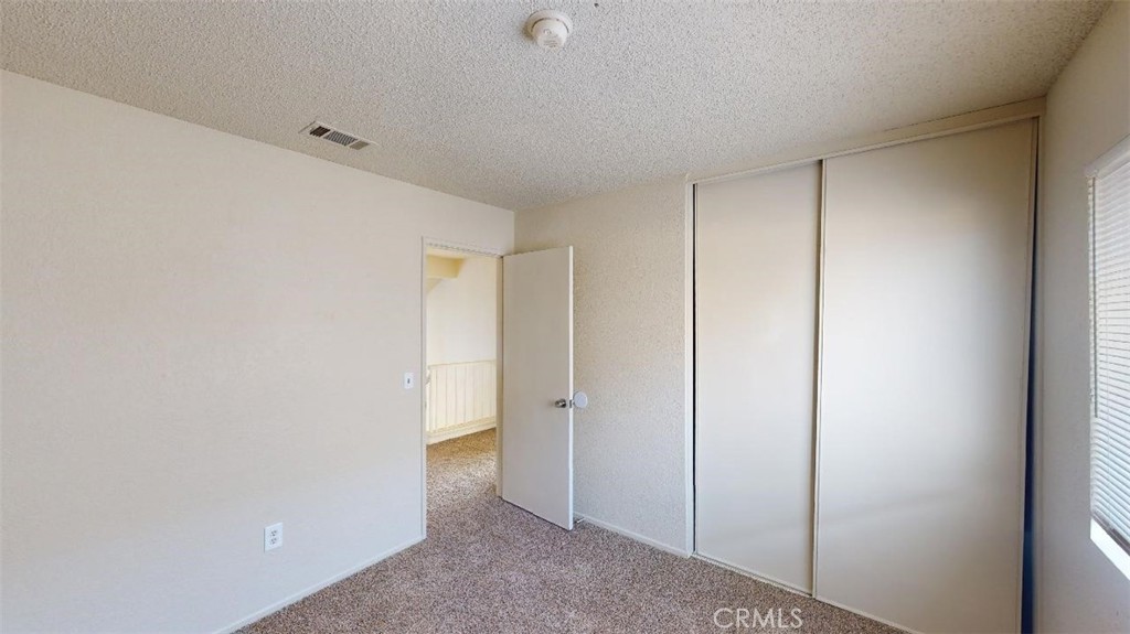 12246 Pluto Drive Victorville, CA 92392 - Photo 19 of 64 a view of an empty room