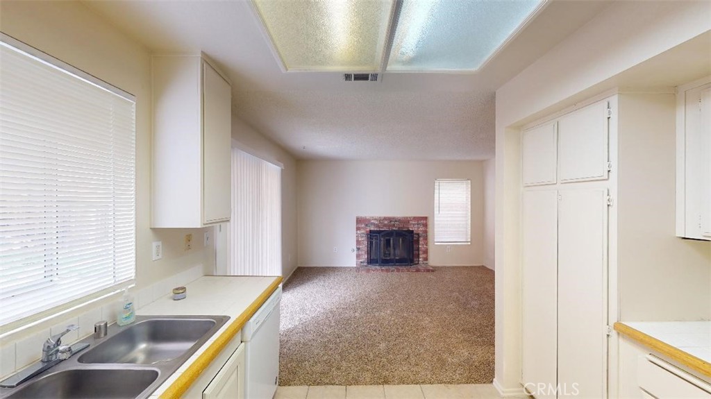12246 Pluto Drive Victorville, CA 92392 - Photo 32 of 64 a view of kitchen with sink and window