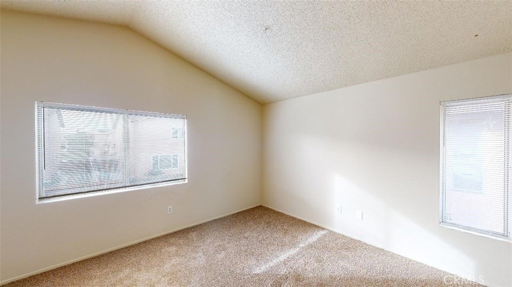 12246 Pluto Drive Victorville, CA 92392 - Photo 38 of 64 an empty room with a window