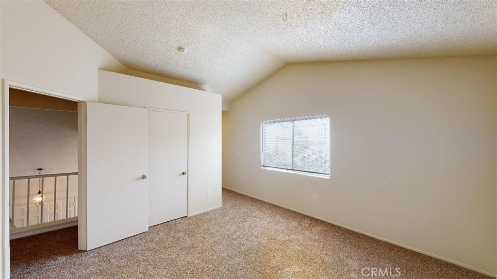 12246 Pluto Drive Victorville, CA 92392 - Photo 39 of 64 an empty room with windows