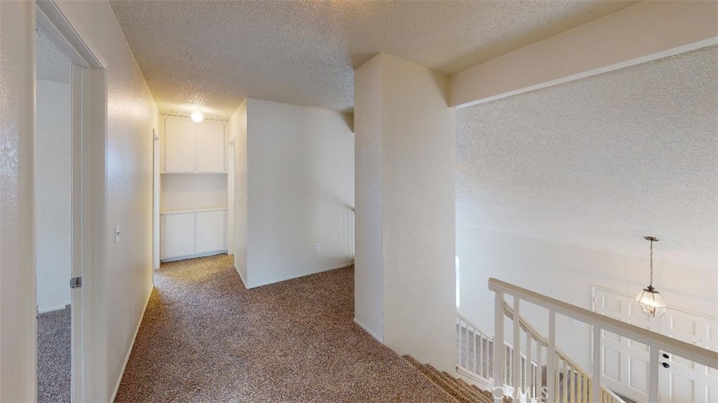12246 Pluto Drive Victorville, CA 92392 - Photo 48 of 64 a view of a hallway with closet area