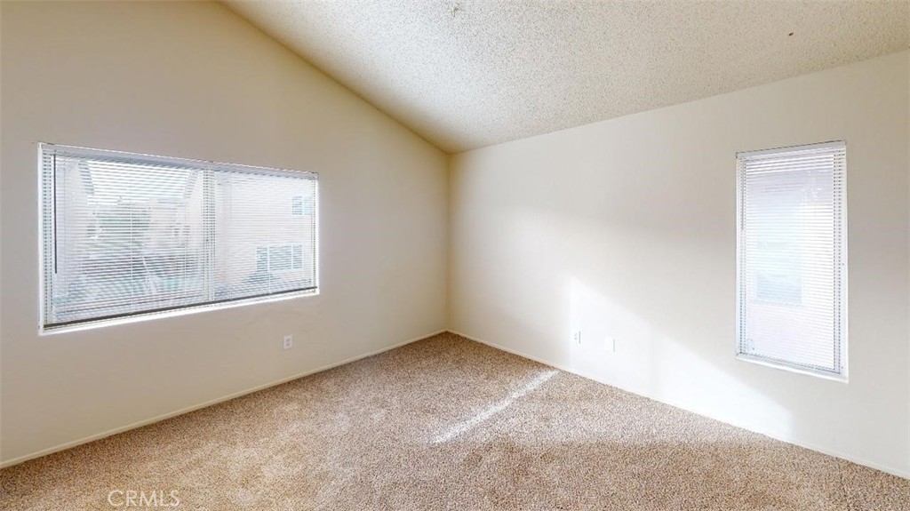 12246 Pluto Drive Victorville, CA 92392 - Photo 52 of 64 an empty room with windows