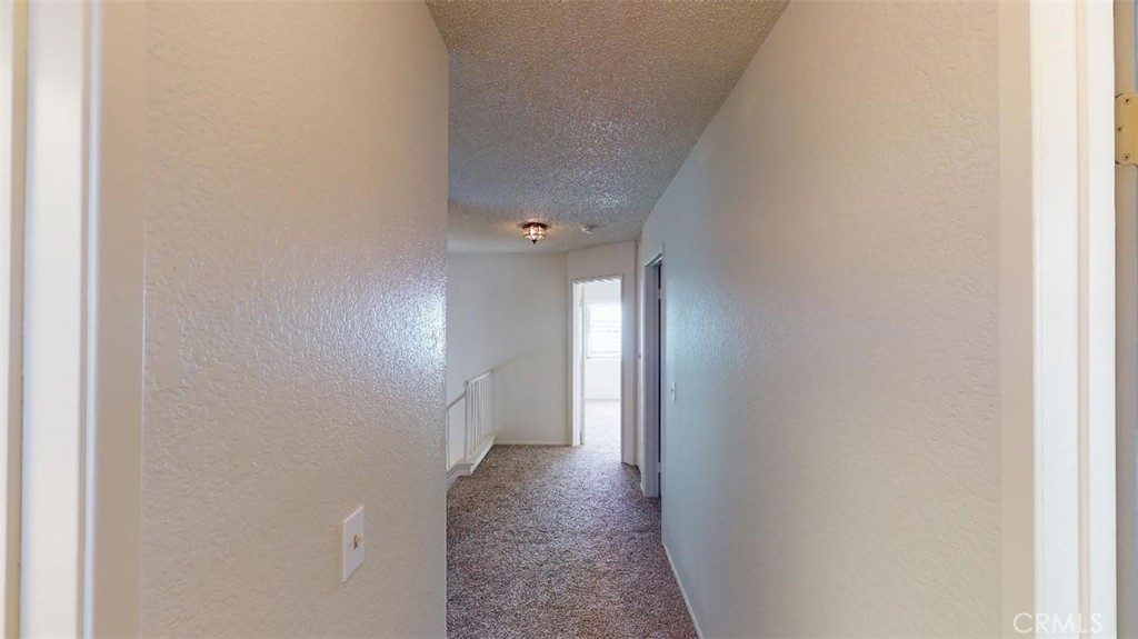 12246 Pluto Drive Victorville, CA 92392 - Photo 58 of 64 a view of a hallway