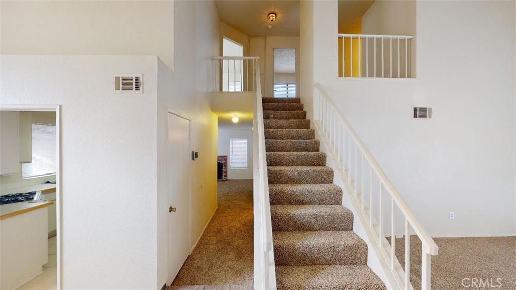 12246 Pluto Drive Victorville, CA 92392 - Photo 8 of 64 a view of an entryway with wooden floor