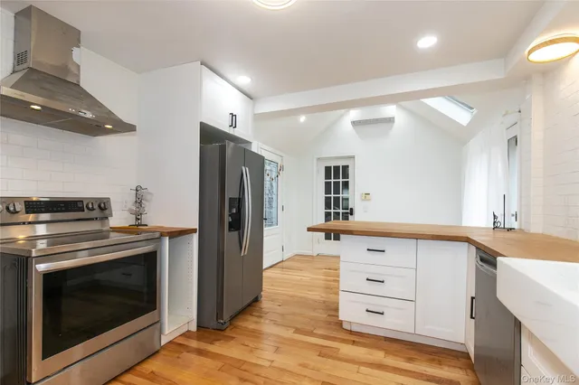 a kitchen with a stove oven and refrigerator