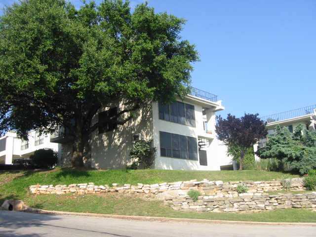 5916 Lago Vista Way, Unit B18 Lago Vista, TX 78645 - Photo 1 of 16 a front view of a house with a yard