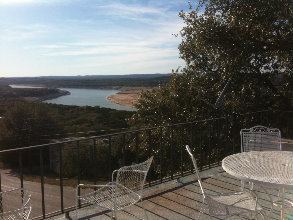 5916 Lago Vista Way, Unit B18 Lago Vista, TX 78645 - Photo 12 of 16 a view of a balcony with chair and potted plants