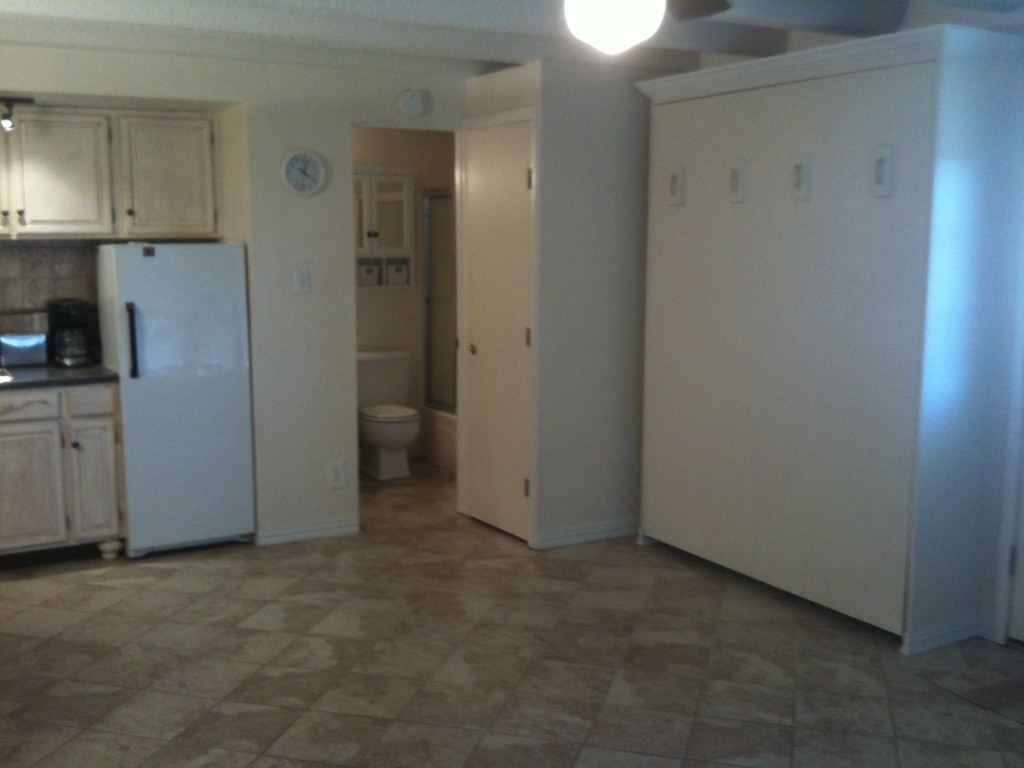 5916 Lago Vista Way, Unit B18 Lago Vista, TX 78645 - Photo 7 of 16 an empty room with closet and windows