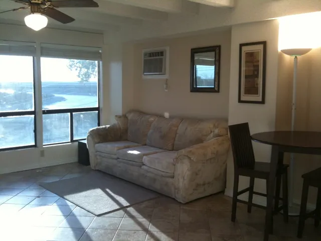 a living room with furniture and a window