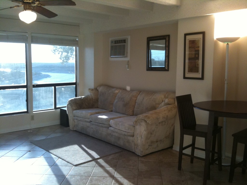 5916 Lago Vista Way, Unit B18 Lago Vista, TX 78645 - Photo 9 of 16 a living room with furniture and a window