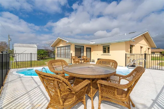 a view of a house dining room and hall with wooden floor