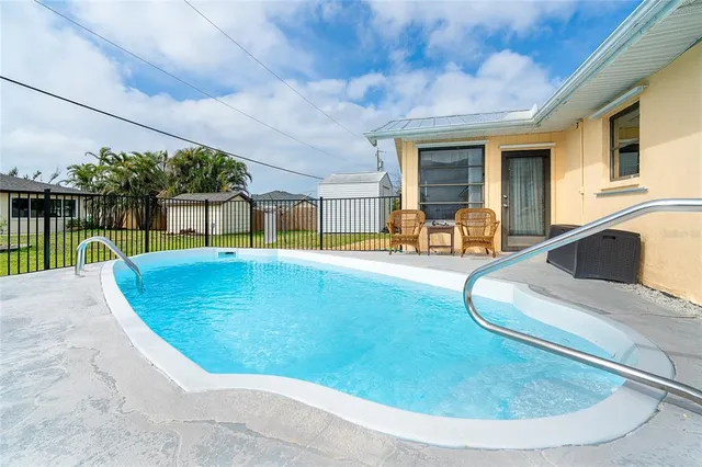 a view of a swimming pool with a patio