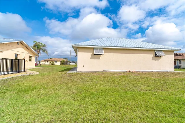 an aerial view of a house with outdoor space