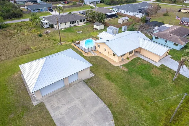 a view of swimming pool with an outdoor space and seating area