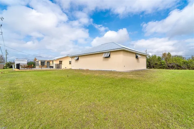 an aerial view of a house with swimming pool