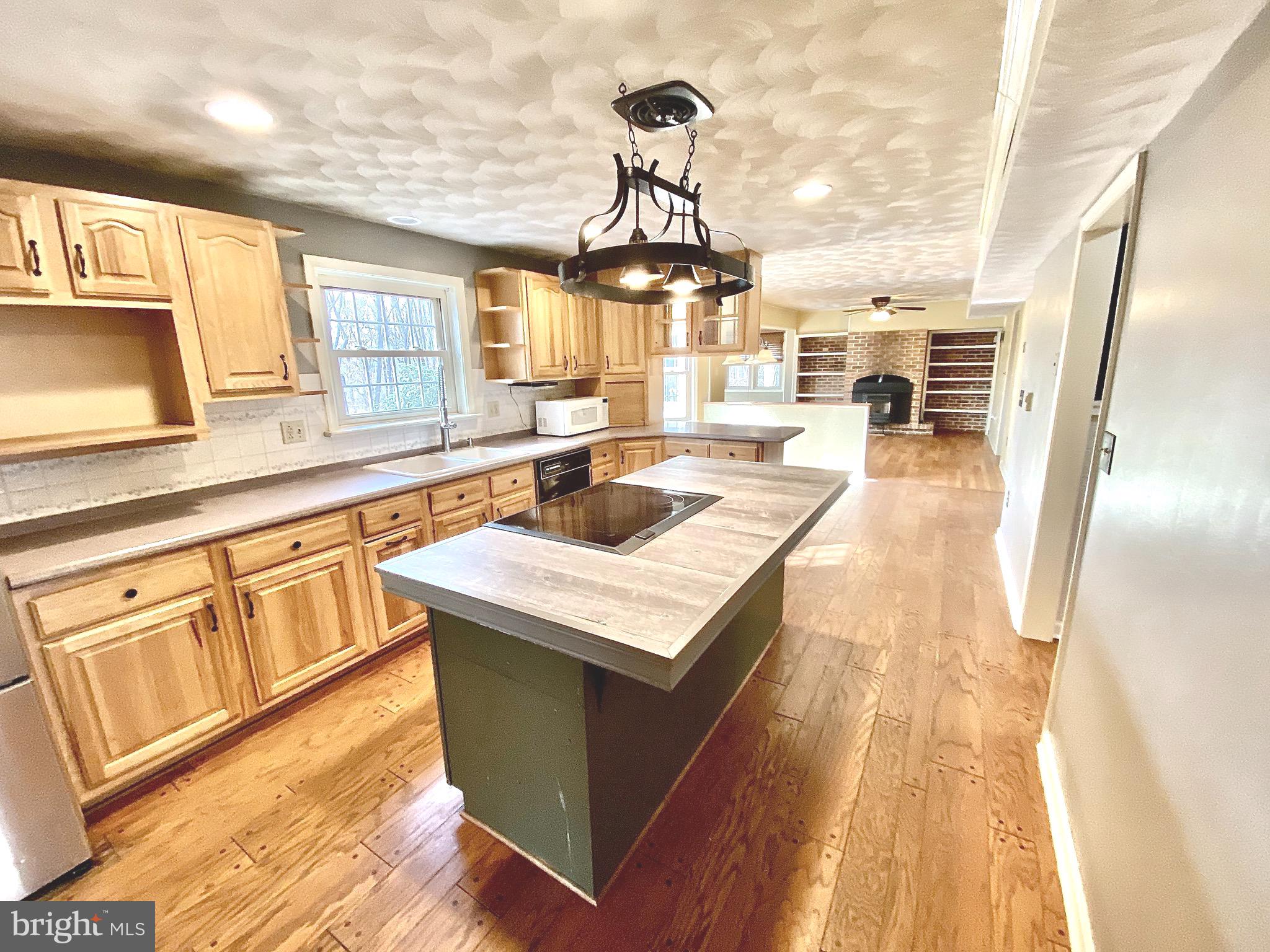 1227 R Woods Road Westminster, MD 21158 - Photo 14 of 68 Center island features built-in rangee & cooktop