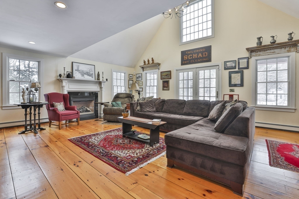 67 Poor Farm Road Harvard, MA 01451 - Photo 6 of 30 a living room with furniture fireplace and rug