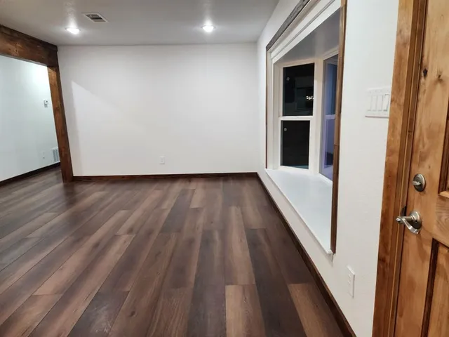 a kitchen with stainless steel appliances granite countertop a sink and a stove