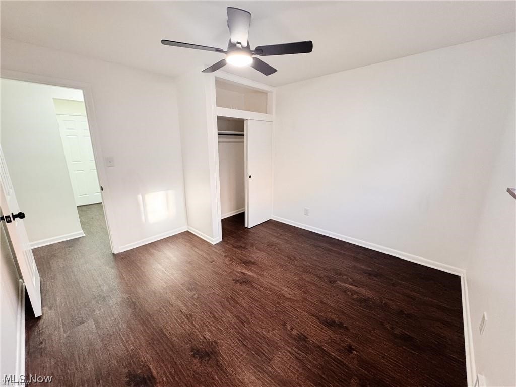 2907 Snow Road, Unit UP Cleveland, OH 44134 - Photo 12 of 19 Unfurnished bedroom featuring dark wood-style floors, a closet, and ceiling fan