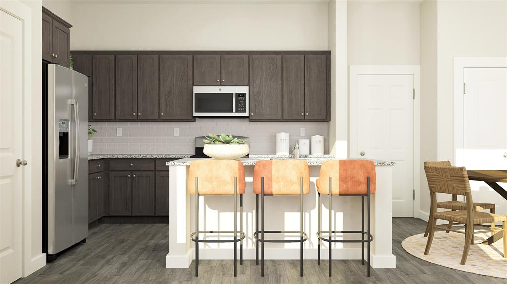 710 Lacewing Drive Arlington, TX 76005 - Photo 6 of 15 a kitchen with stainless steel appliances granite countertop a refrigerator and microwave
