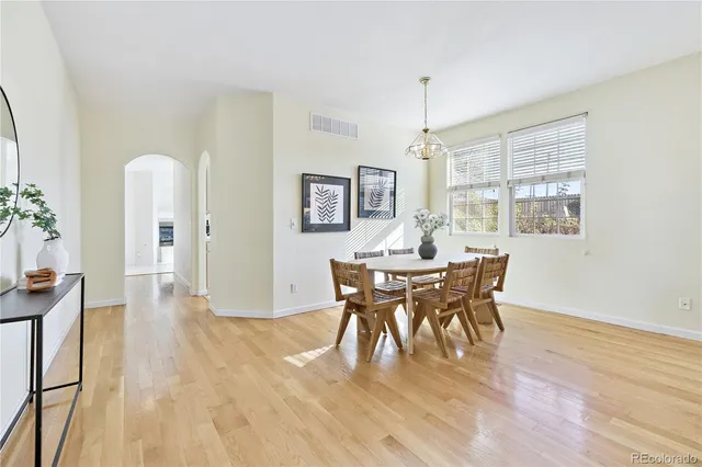 a view of a dining room with furniture and window