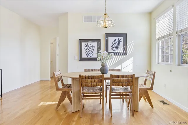 a view of a dining room with furniture wooden floor and a rug