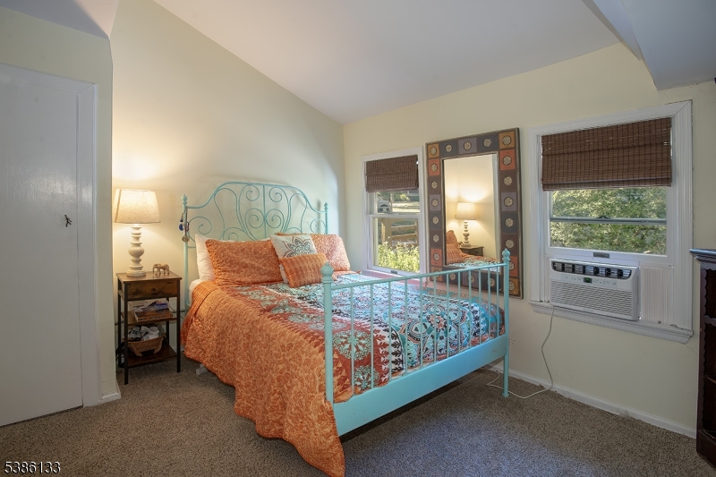 116 East Shore Trail Sparta, NJ 07871 - Photo 14 of 17 a bed sitting in a bedroom next to a window