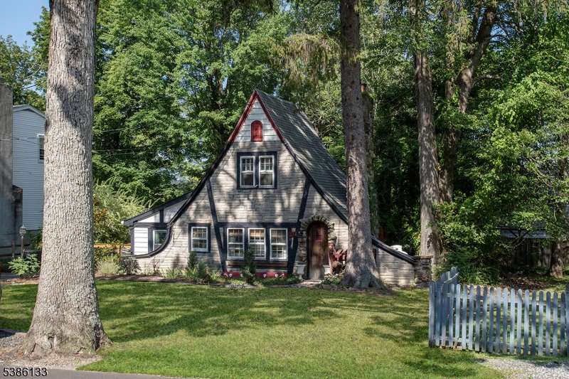 116 East Shore Trail Sparta, NJ 07871 - Photo 2 of 17 a view of a house with a small yard and a large tree