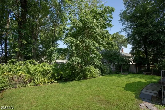 a kitchen with stainless steel appliances granite countertop a refrigerator and a stove