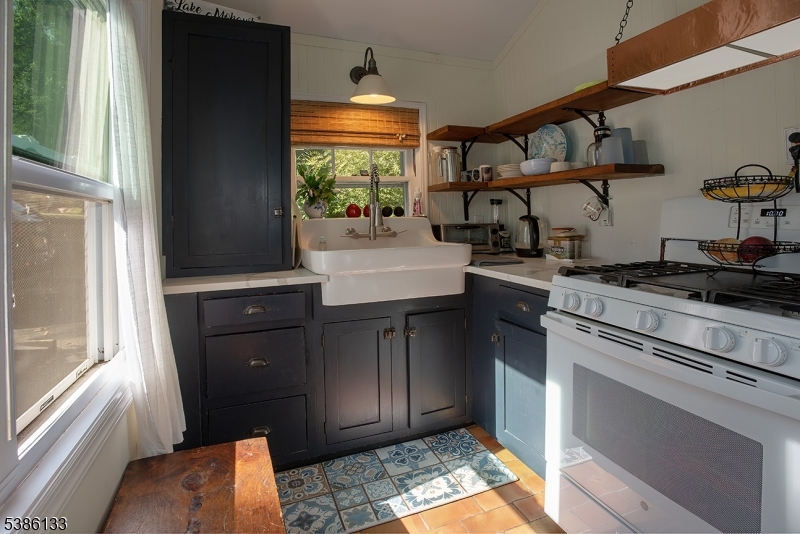 116 East Shore Trail Sparta, NJ 07871 - Photo 9 of 17 a kitchen with stainless steel appliances granite countertop a refrigerator and a stove