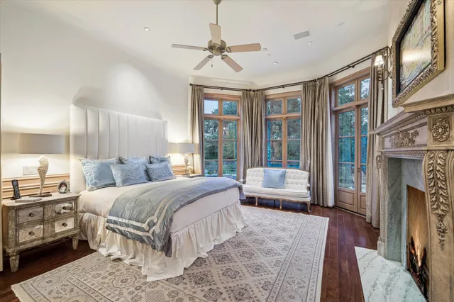 a bedroom with a bed couch and a window