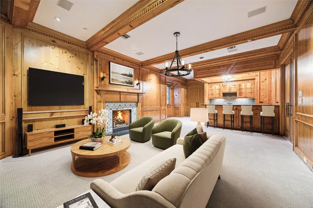 a view of an empty room with a fireplace and a window