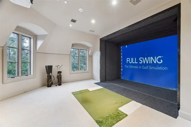 a view of a big yard with large trees