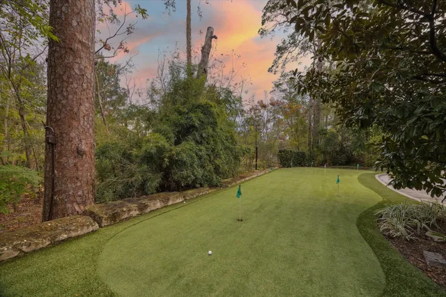 a bedroom with a bed and glass door