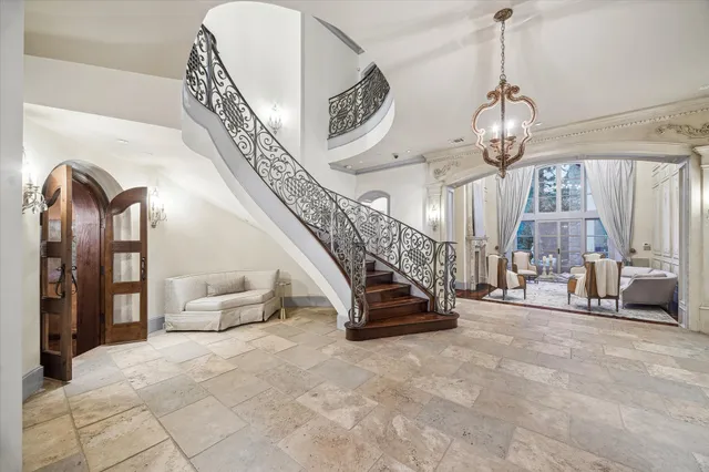 a view of hall way with furniture