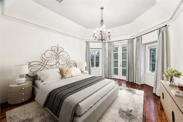 a spacious bathroom with a granite countertop sink and a mirror