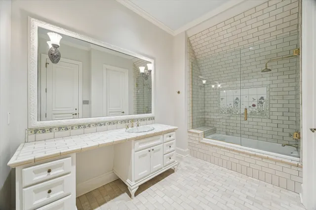 a view of a kitchen with stainless steel appliances granite countertop a sink a stove a washer and dryer