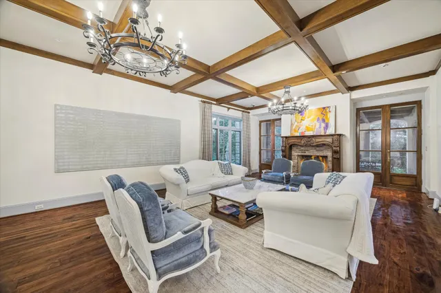 a living room with furniture a fireplace and a table