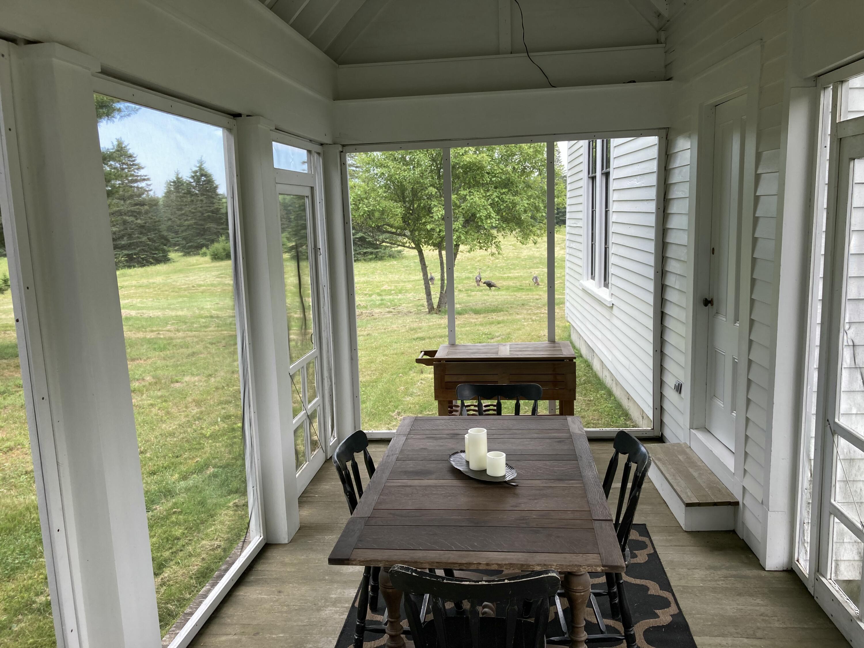 384 Point Road Hancock, ME 04640 - Photo 16 of 70 Screened porch from great room.