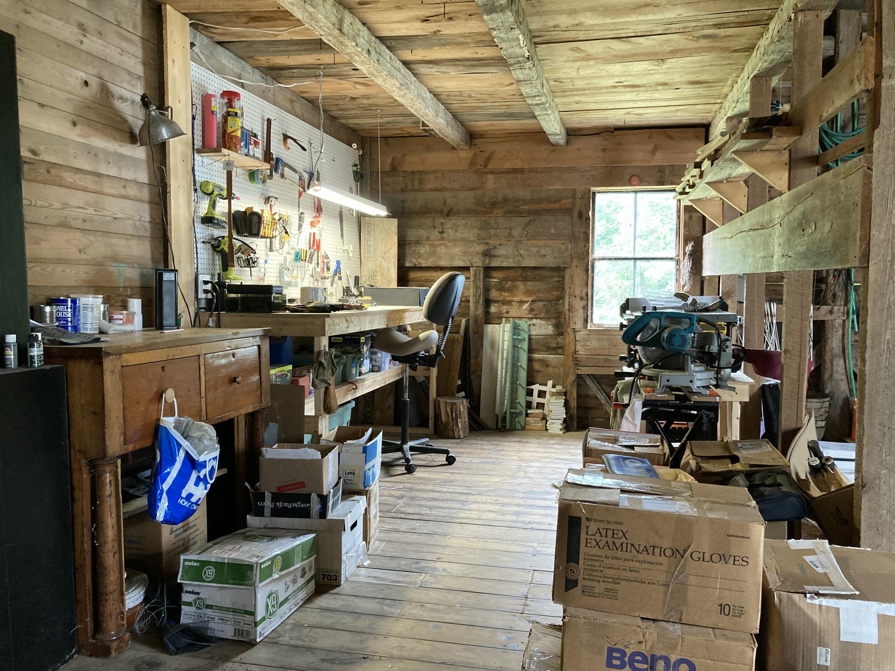 384 Point Road Hancock, ME 04640 - Photo 19 of 70 Barn workshop & work bench.