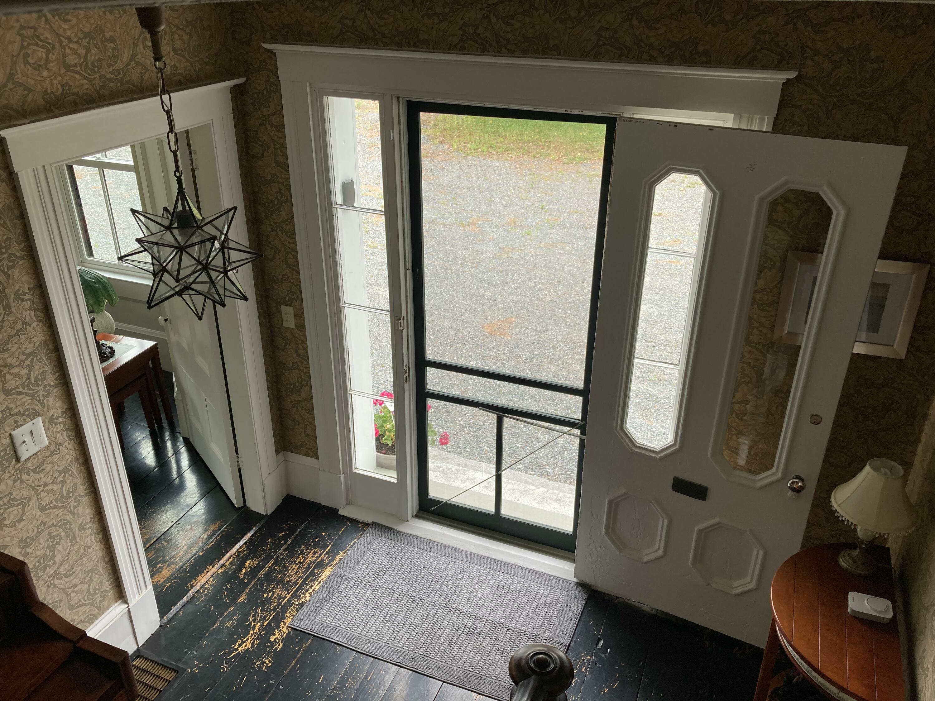 384 Point Road Hancock, ME 04640 - Photo 5 of 70 Front entry opening into living room.