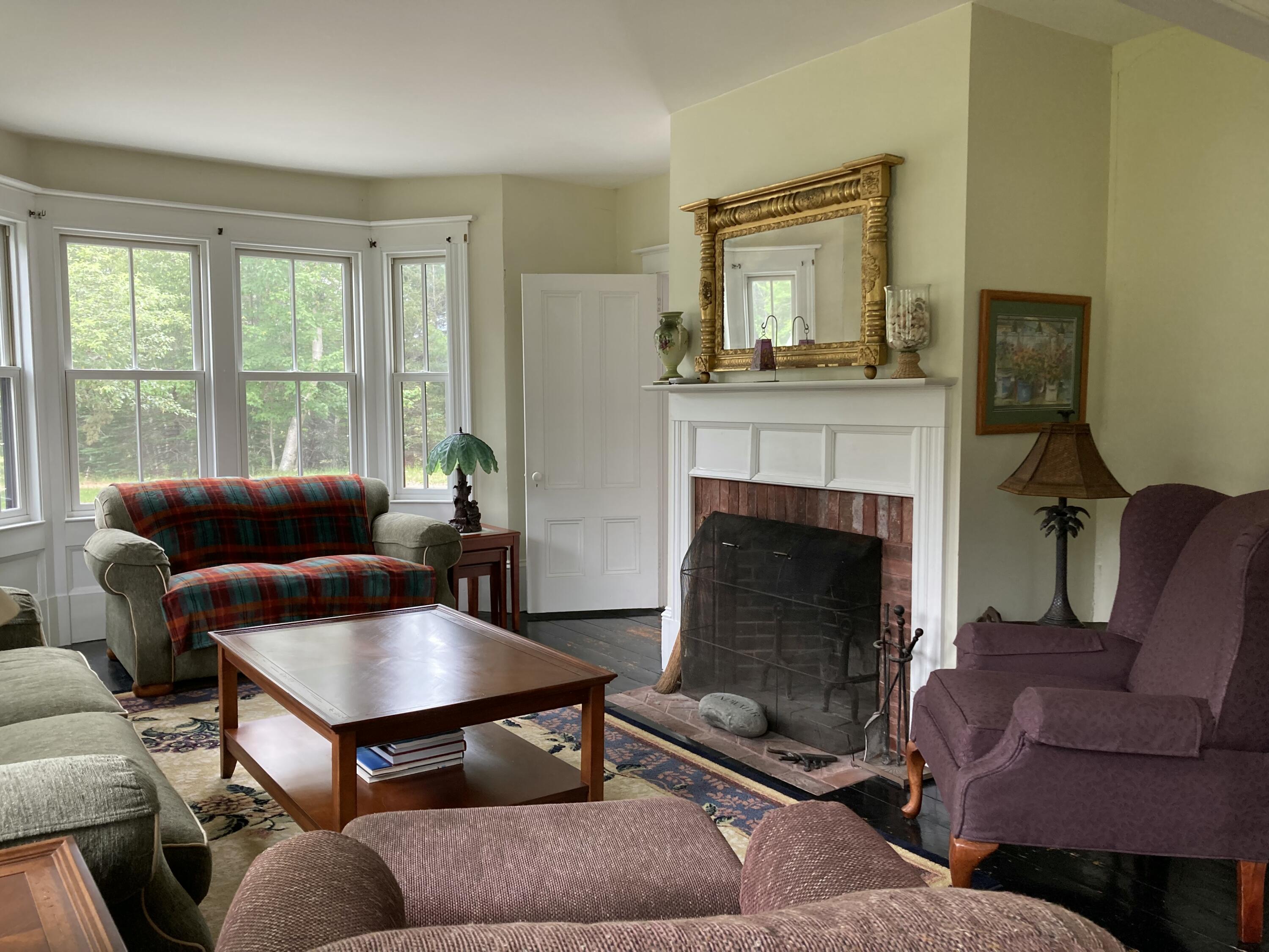 384 Point Road Hancock, ME 04640 - Photo 6 of 70 Living room with bay window & WB FPLC.