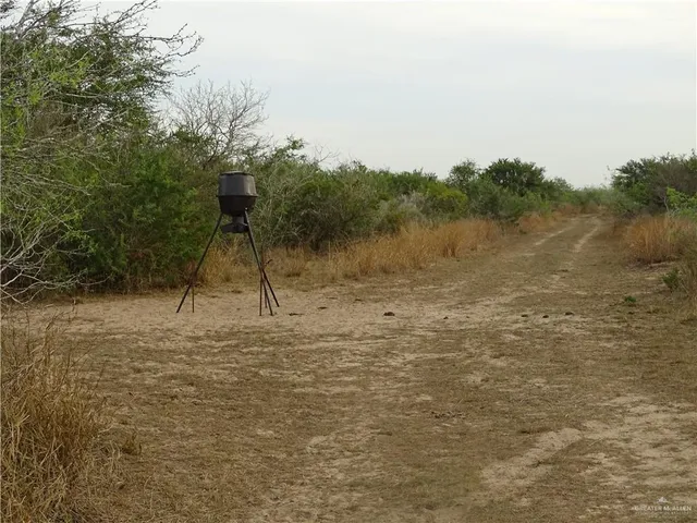 a lake view with a wooden fence