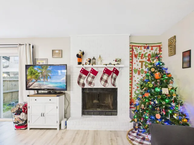 a living room with furniture and flowers
