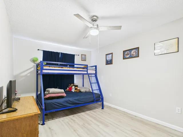 a bed room with a bed and furniture