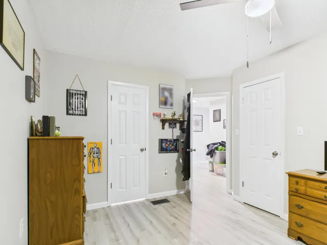 a view of a livingroom with wooden floor and closet