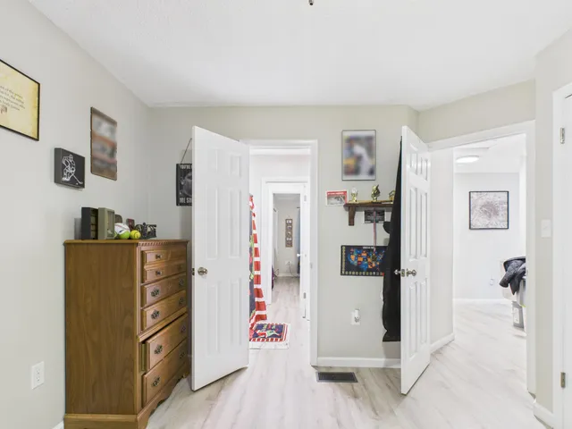a view of a kitchen with refrigerator and cabinet