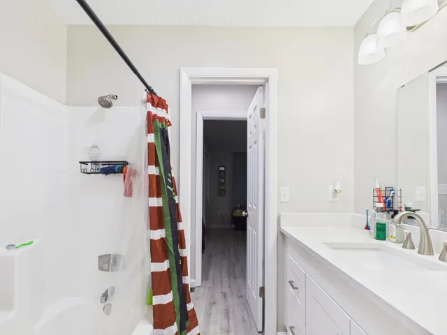 a bathroom with a bathtub and a sink