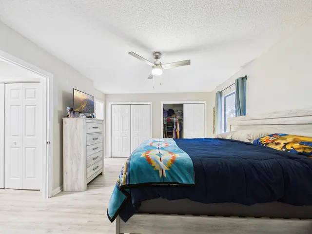 a bedroom with a bed and a closet