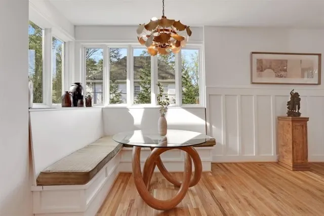 a bedroom with a bed and a wooden floor